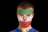 Serious young iran fan with facepaint