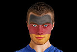 Serious young germany fan with facepaint