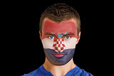 Serious young croatia fan with facepaint