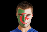 Serious young algeria fan with facepaint