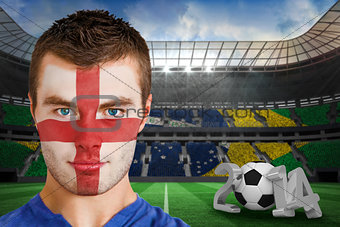 Serious young england fan with facepaint