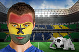 Serious young ghana fan with face paint