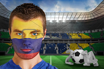 Serious young colombia fan with face paint