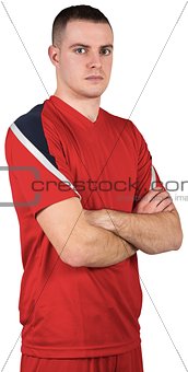 Handsome football player looking at camera