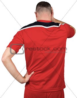Disappointed football player looking down