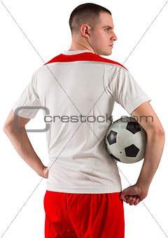 Football player holding the ball