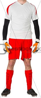 Goalkeeper in red and white standing