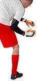 Goalkeeper in red and white ready to catch
