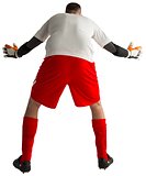 Goalkeeper in red and white ready to catch