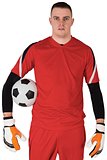 Goalkeeper in red looking at camera