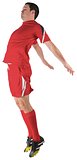 Football player in red jumping