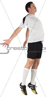 Football player in white jumping