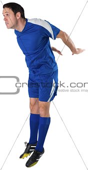 Football player in blue jumping