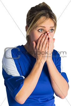 Nervous football fan in blue jersey