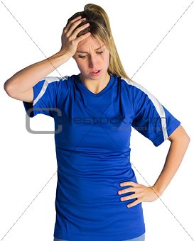 Disappointed football fan in blue jersey