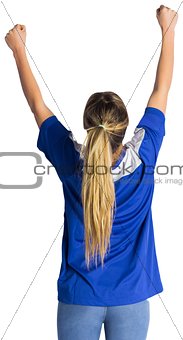 Cheering football fan in blue jersey