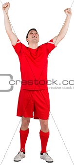 Excited young football player cheering
