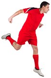 Fit football player jumping up