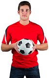 Handsome football fan in red jersey
