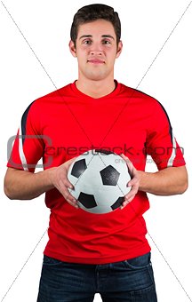 Handsome football fan in red jersey