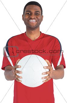 Handsome football fan looking at camera