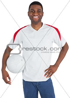 Handsome football fan looking at camera