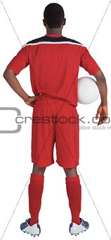 Handsome football player in red jersey