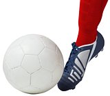 Football player kicking ball with boot