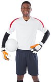 Goalkeeper in white holding ball