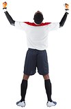 Excited goalkeeper in white cheering