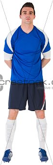 Handsome football player in blue jersey
