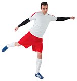 Football player in white kicking