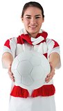Football fan in white wearing scarf holding ball