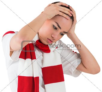Disappointed football fan looking down