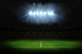 Football pitch under spotlights