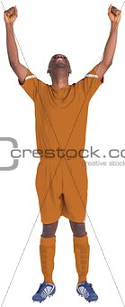 Cheering football player in orange jersey