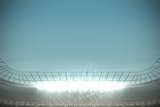 Large football stadium under blue sky