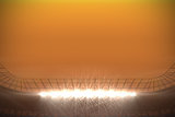 Large football stadium under orange sky