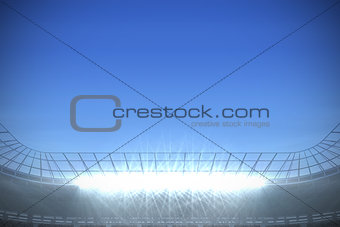 Large football stadium under bright blue sky