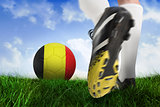 Football boot kicking belgium ball
