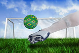 Close up of football player kicking brasil ball