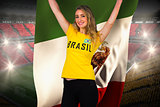 Excited football fan in brasil tshirt holding mexico flag