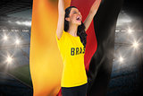 Excited football fan in brasil tshirt holding germany flag