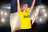 Excited football fan in brasil tshirt holding france flag