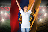 Pretty football fan in white cheering holding ecuador flag