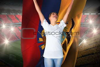 Pretty football fan in white cheering holding ecuador flag
