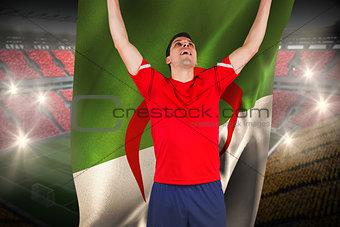 Excited football player cheering holding algeria flag