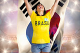 Excited football fan in brasil tshirt holding south korea flag