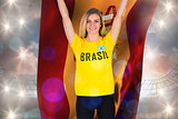 Excited football fan in brasil tshirt holding spain flag