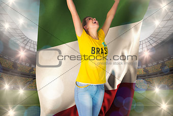 Excited football fan in brasil tshirt holding italy flag